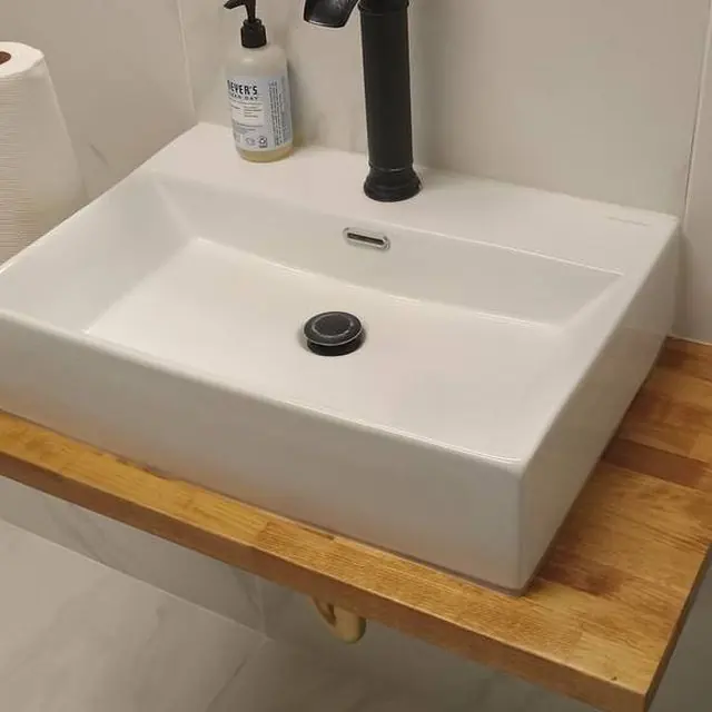 Restroom: Vanity, fixtures and floor